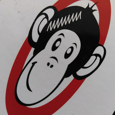 stitch monkey sewing machine repair service logo